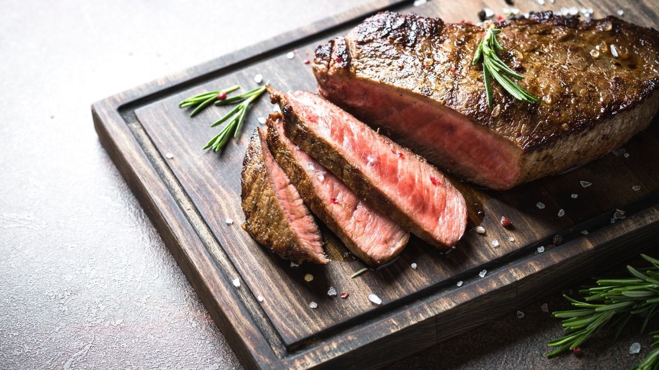 Steak on chopping board