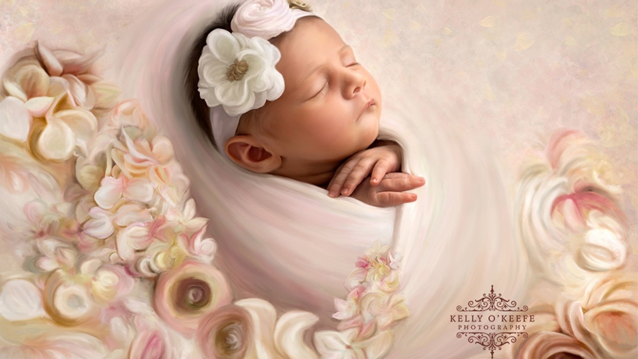 Baby swaddled with flowers surrounding her