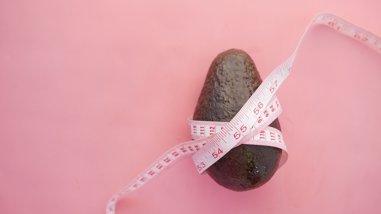 Avocado rapped in a measuring tape