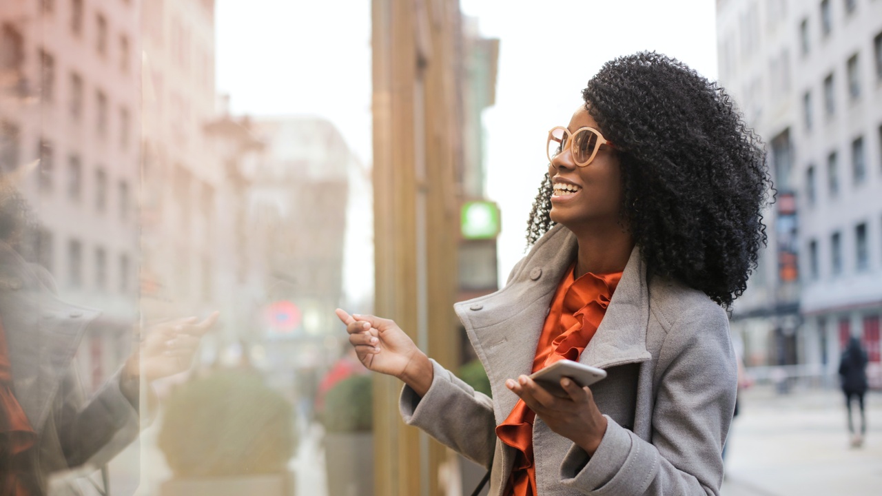 woman checking out a window display