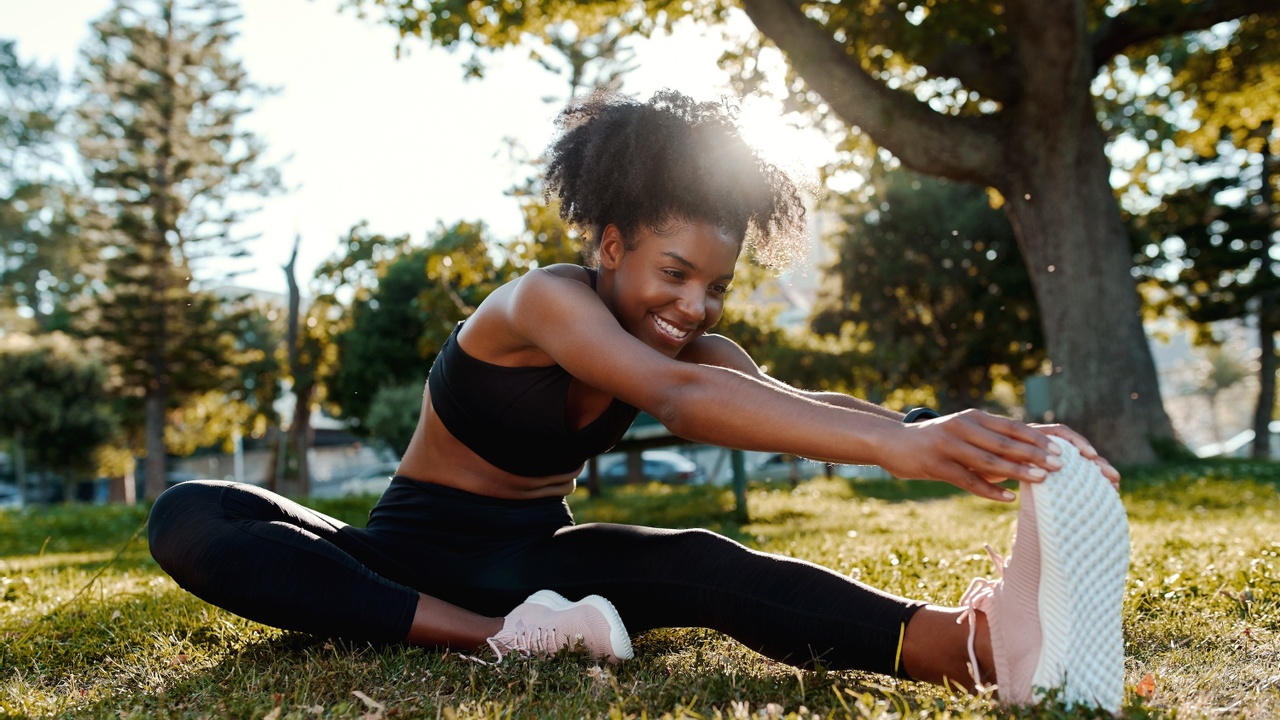 woman stretching on the grass