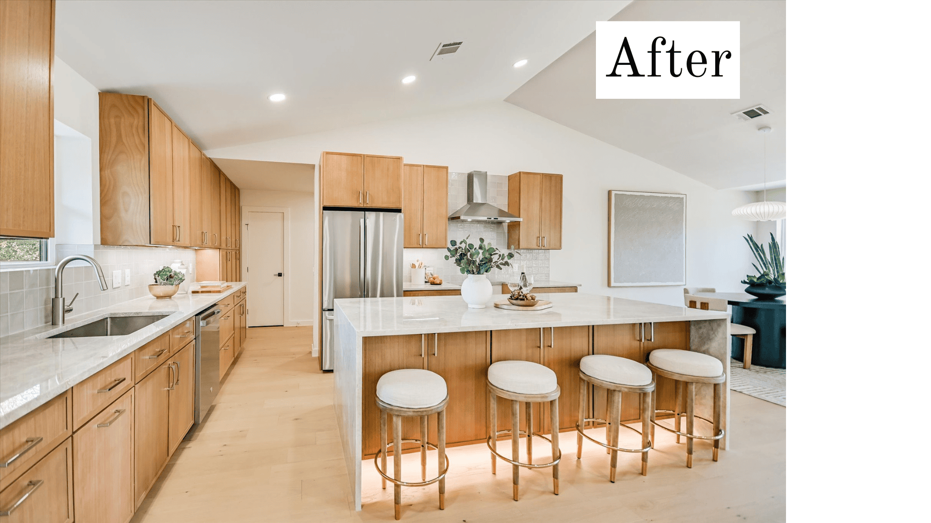 A bright, warmly lit kitchen labeled 