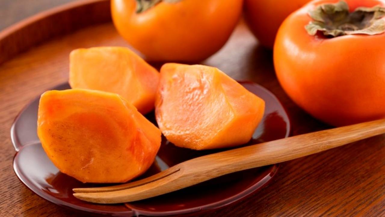 Sliced persimmons on a plate