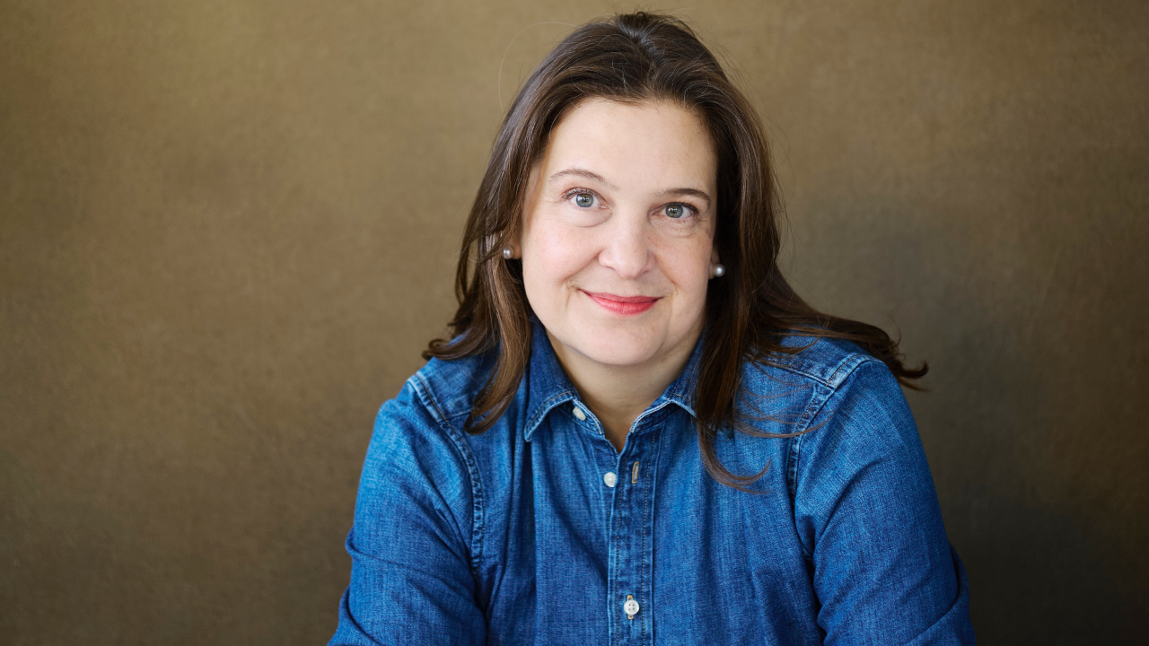 Food writer Anna Ansari smiling and wearing a denim shirt 