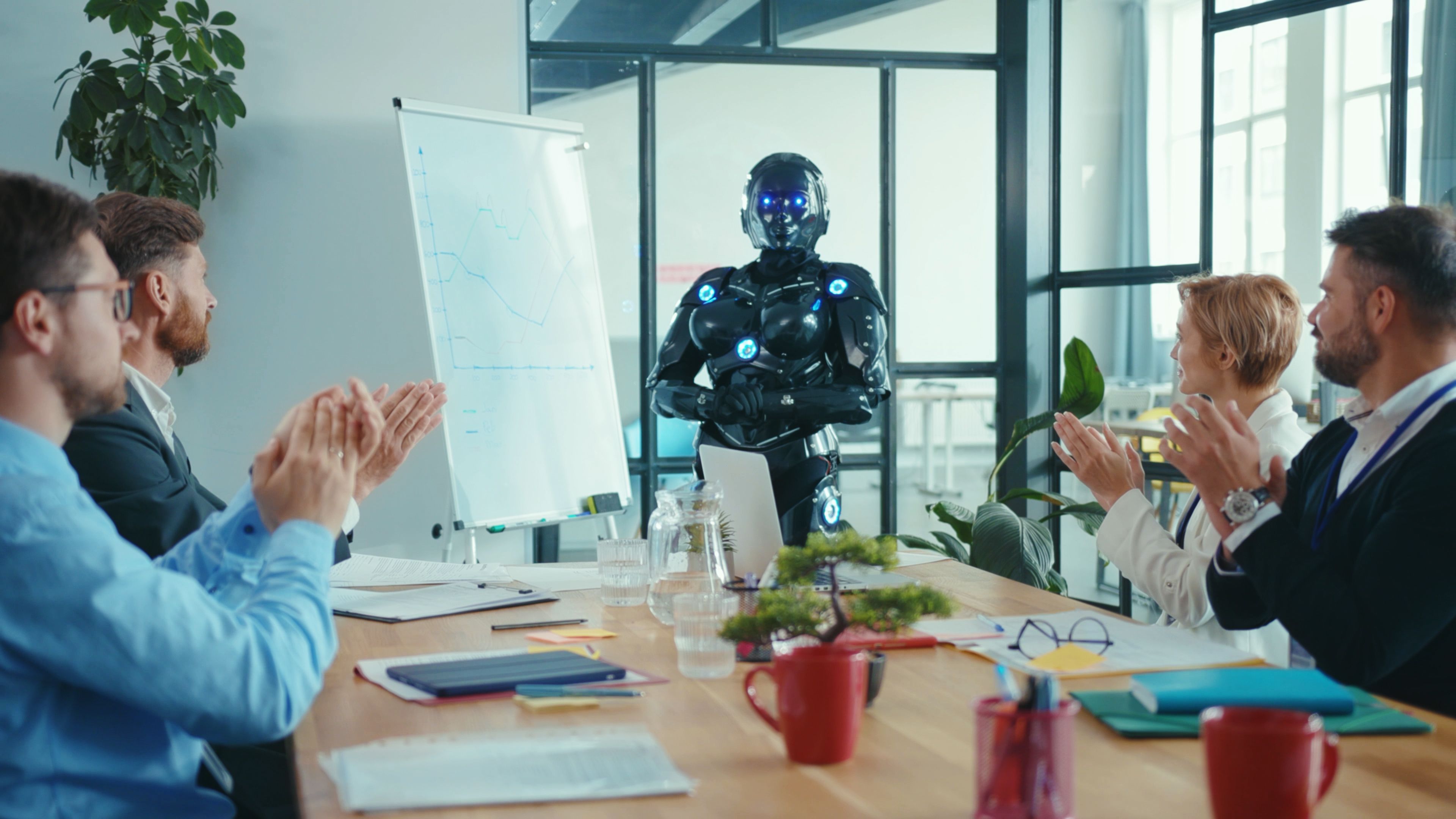 A robot leading a team meeting