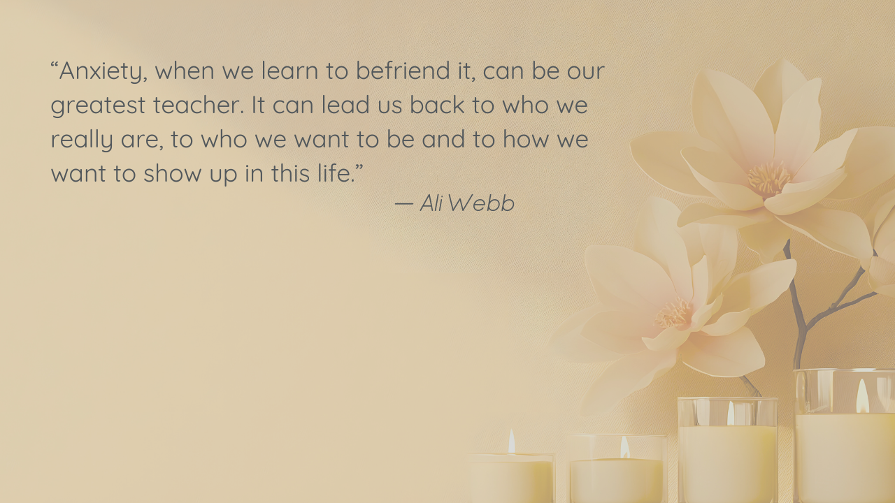A row of lit candles in glass jars sits beneath a floral arrangement against a gold background.