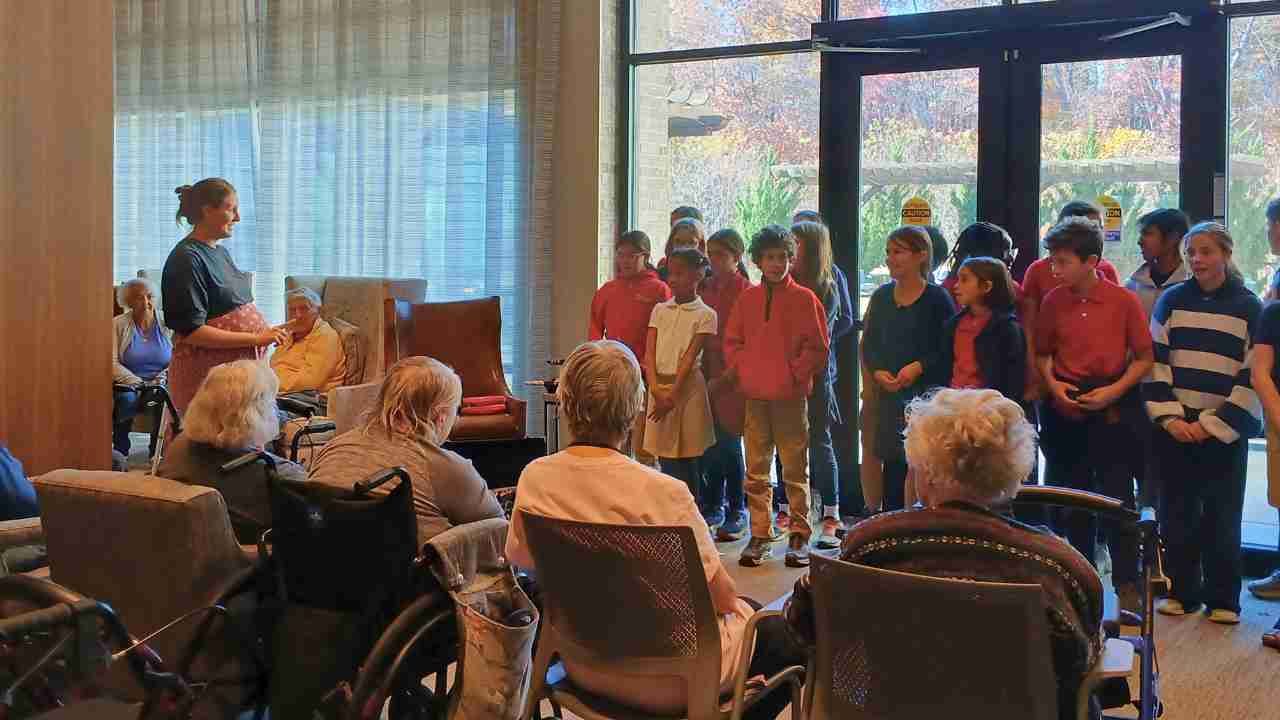 children singing at a retirement community