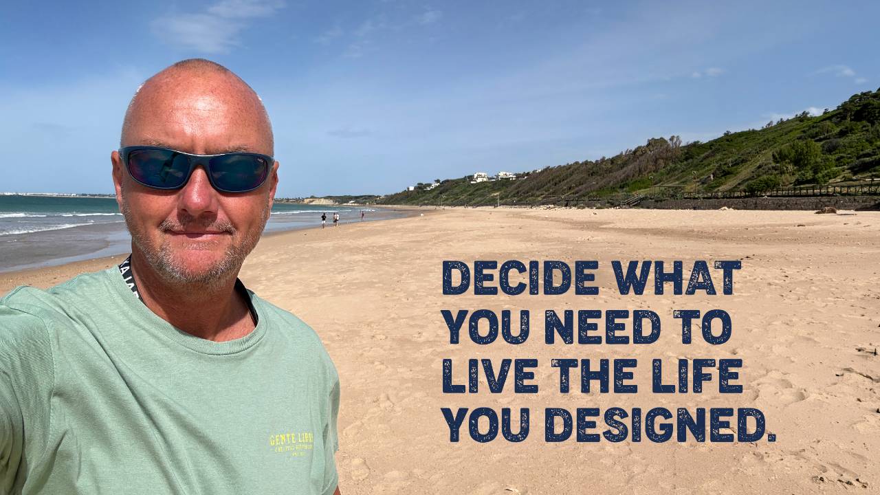 Andy Brown, Kajabi Expert and Coaching Business Growth Strategist, on the beach in Spain.
