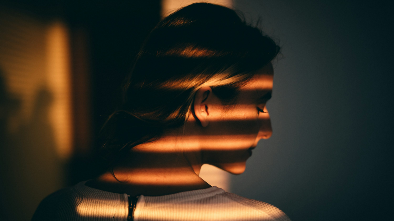 Woman reflecting on guilt, shame, and self-compassion healing