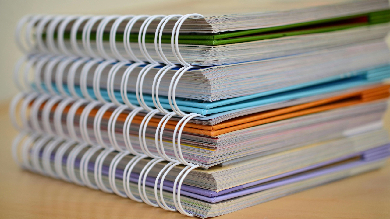 old notebooks symbolising the vast amounts of ideas trapped in notebooks that's buried instead of working for experts 