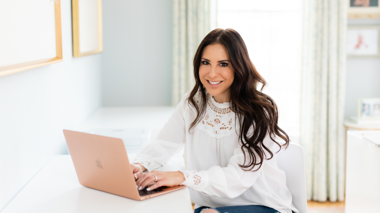 Professional organizer setting up her Asana project management tool on a laptop