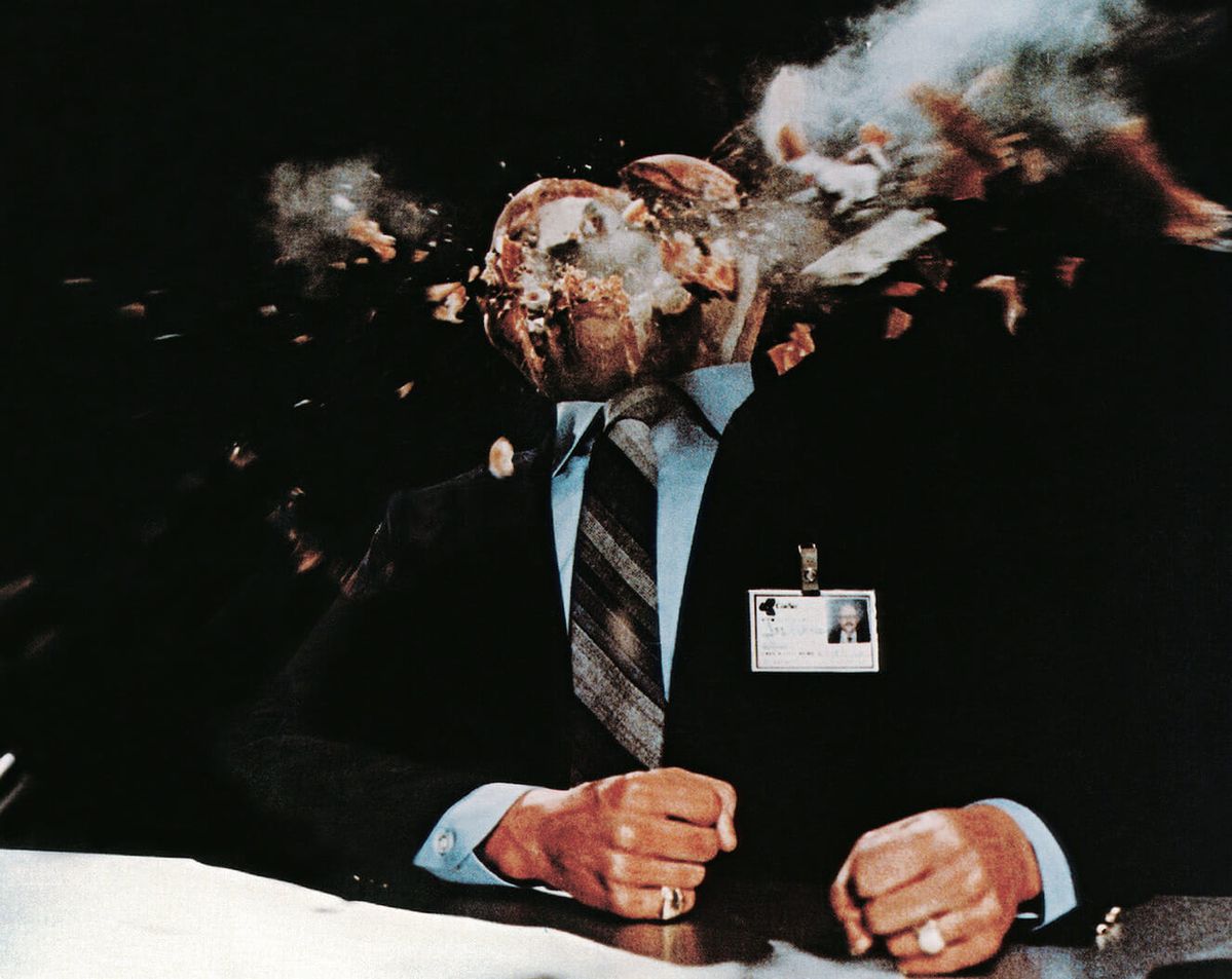 Business man with head exploding