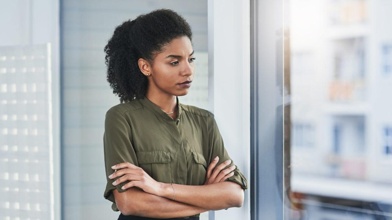 Woman thinking by window