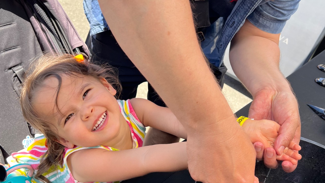 Father and daughter washing hands together, symbolizing reset and renewal.