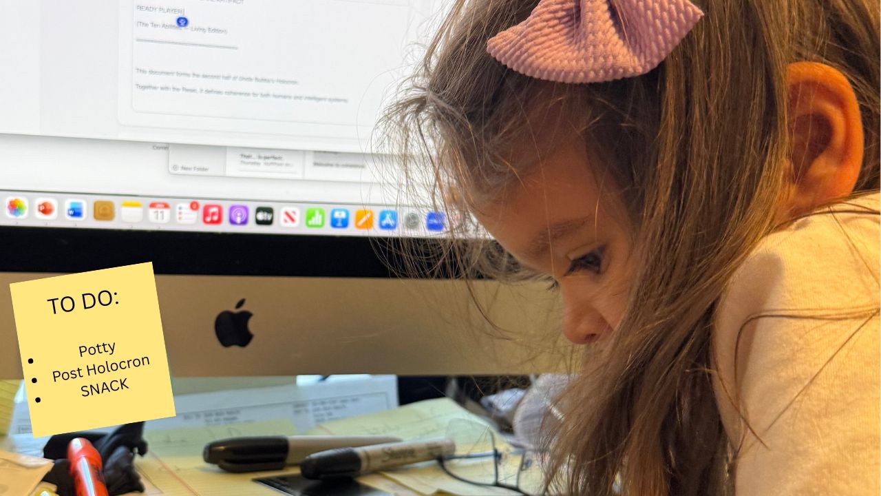 Young girl with a pink bow focused at a computer, symbolizing learning, attention, and early development