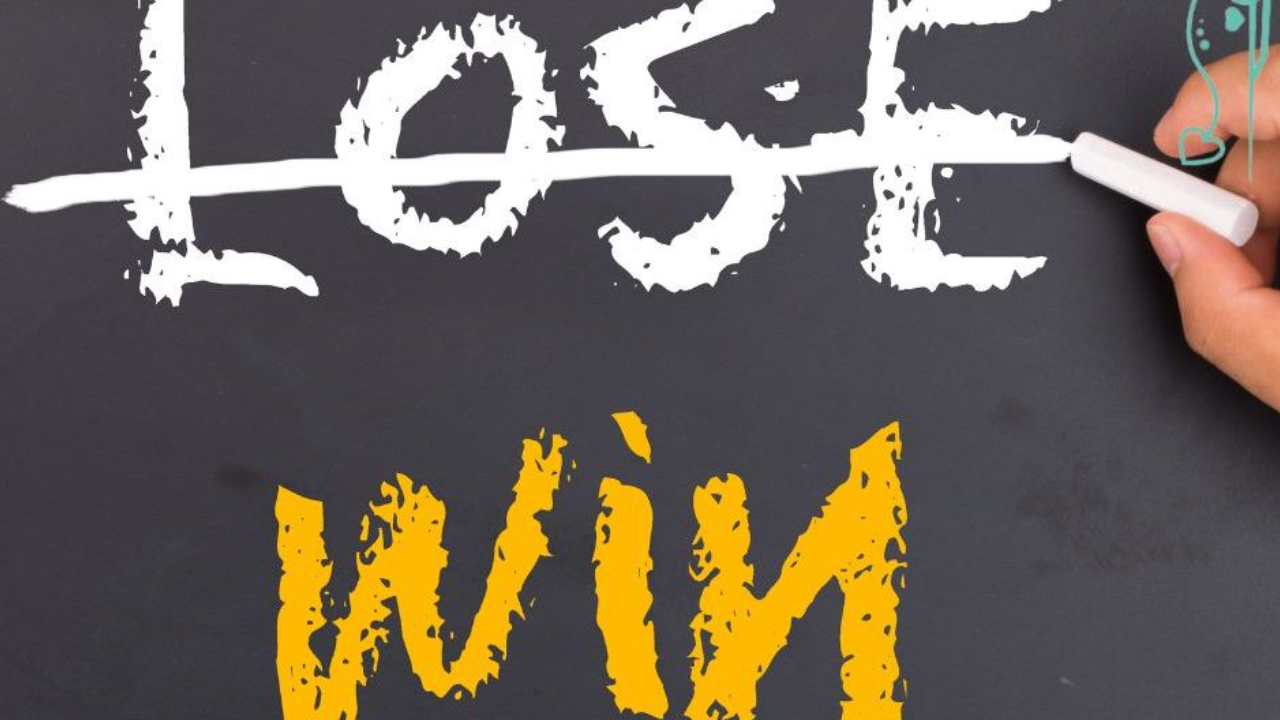 A blackboard with someone crossing out the word Lose with the word Win written under it, dog training, conformation dog training, dog sports, dog shows, Sandy Weaver, coaching, online seminar, in person seminar