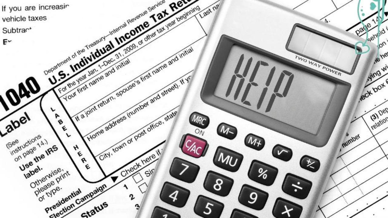 An IRS 1040 tax form with a calculator on it, dog show, dog training, conformation dog training, conformation seminars, wagalicious, Sandy Weaver