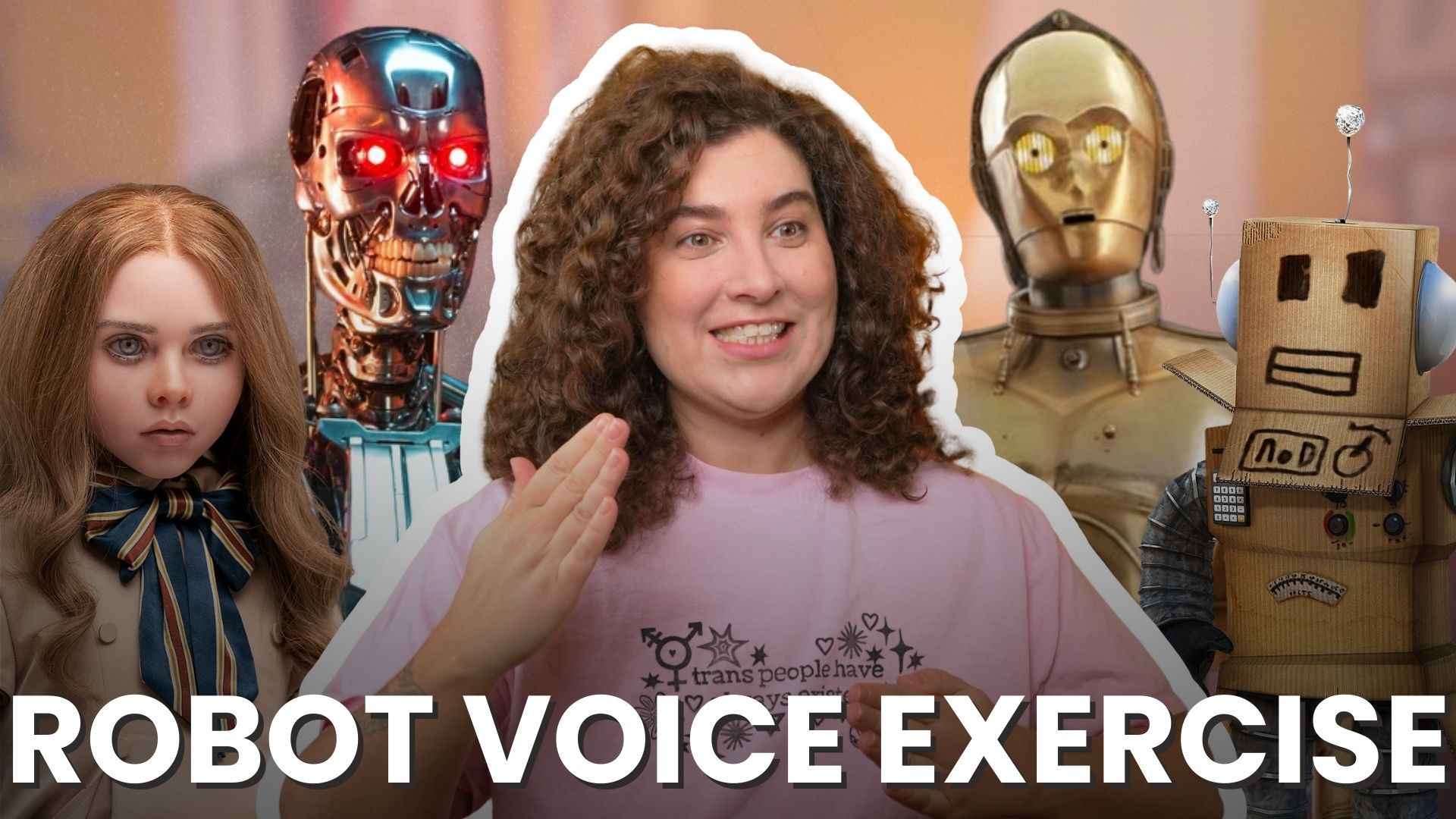 Renée Yoxon in pink "trans people have always existed" shirt surrounded by robots including C-3PO and cardboard robot for Robot Voice Exercise transgender voice training tutorial