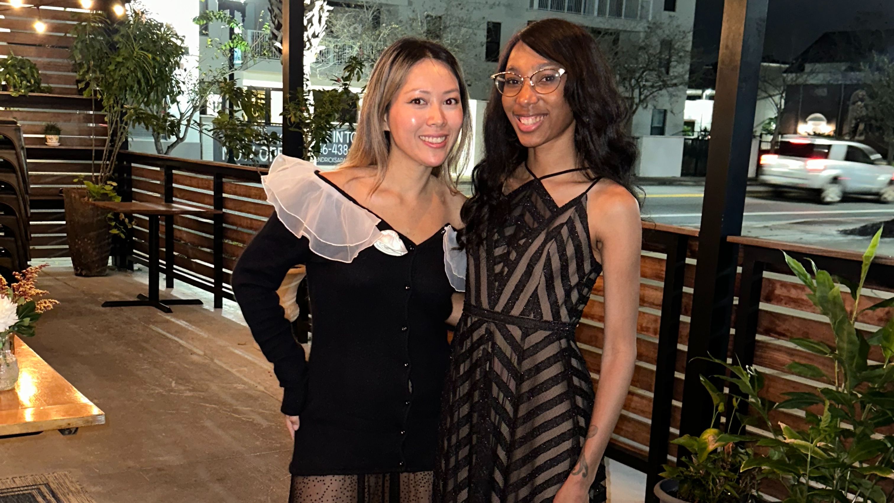 The image depicts Sabrina Whittaker and a close friend who loves this topic, posing outside of Rue St. Marc in Jacksonville, Florida.