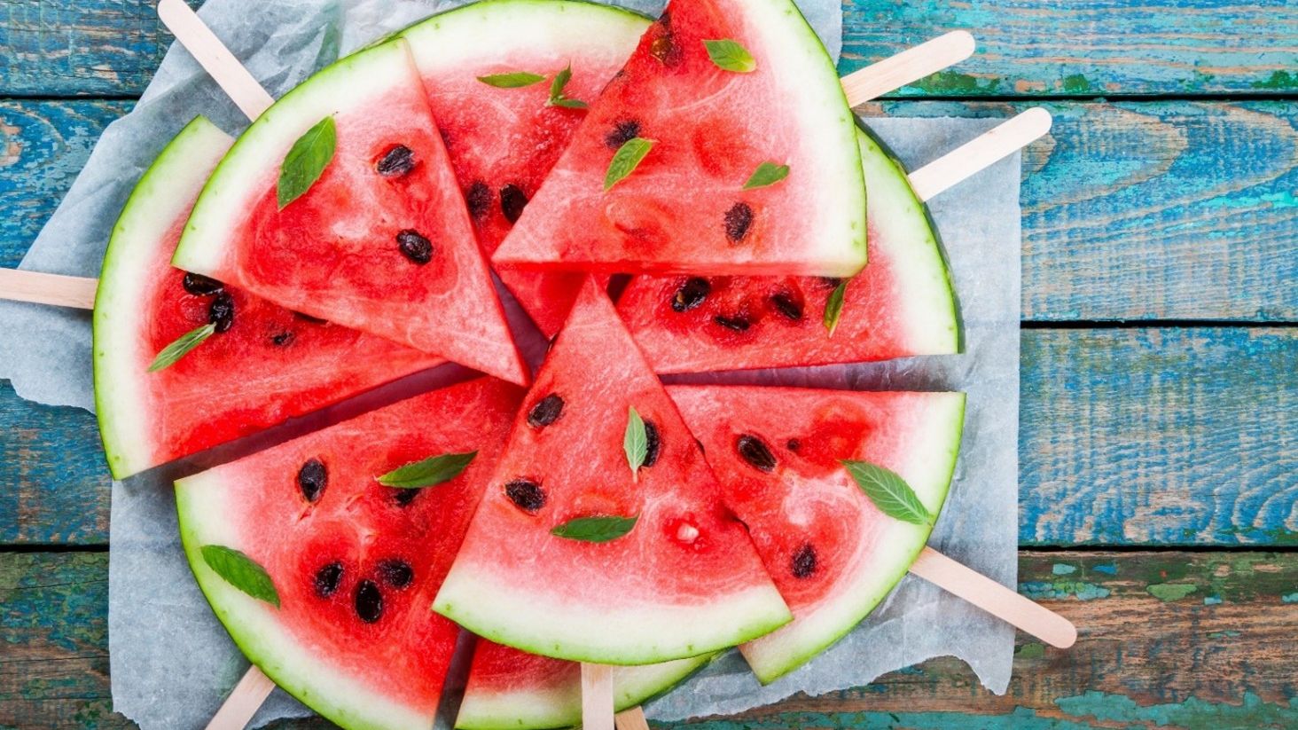 Watermelon slice on stick natural sun protection food.