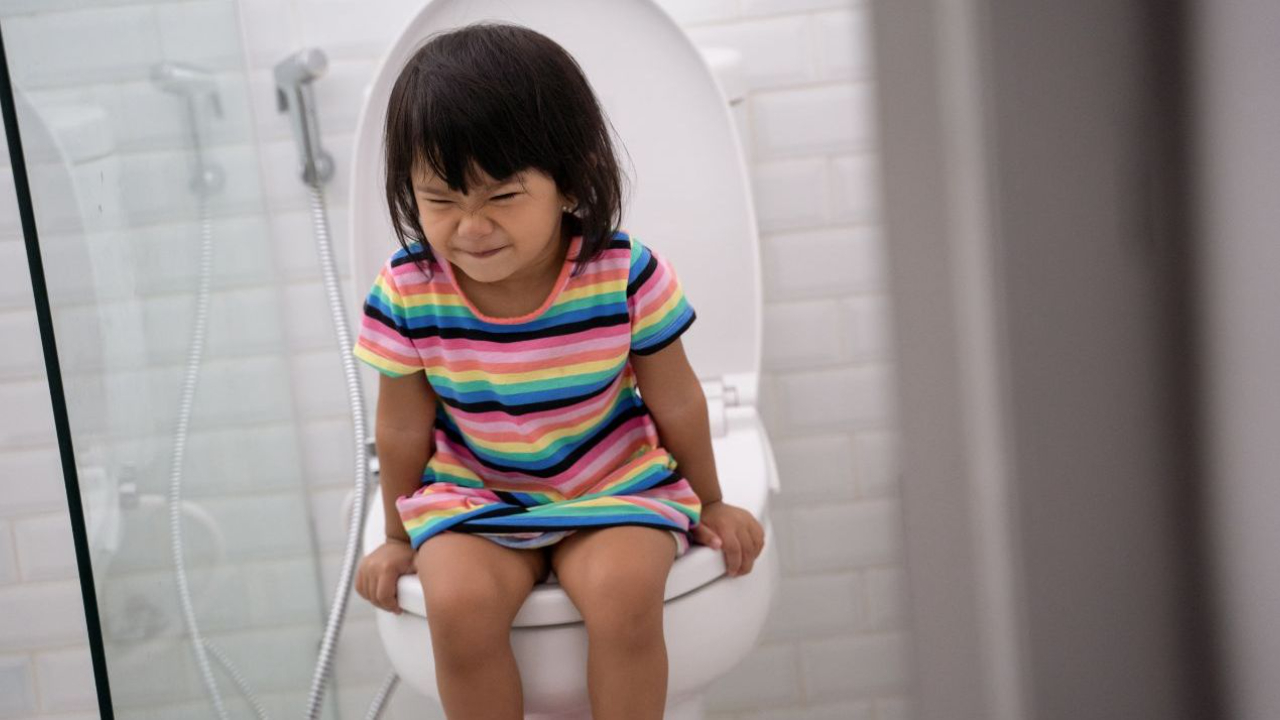 A Constipated Young Girl Using A Potty by Ron Sutherland/science