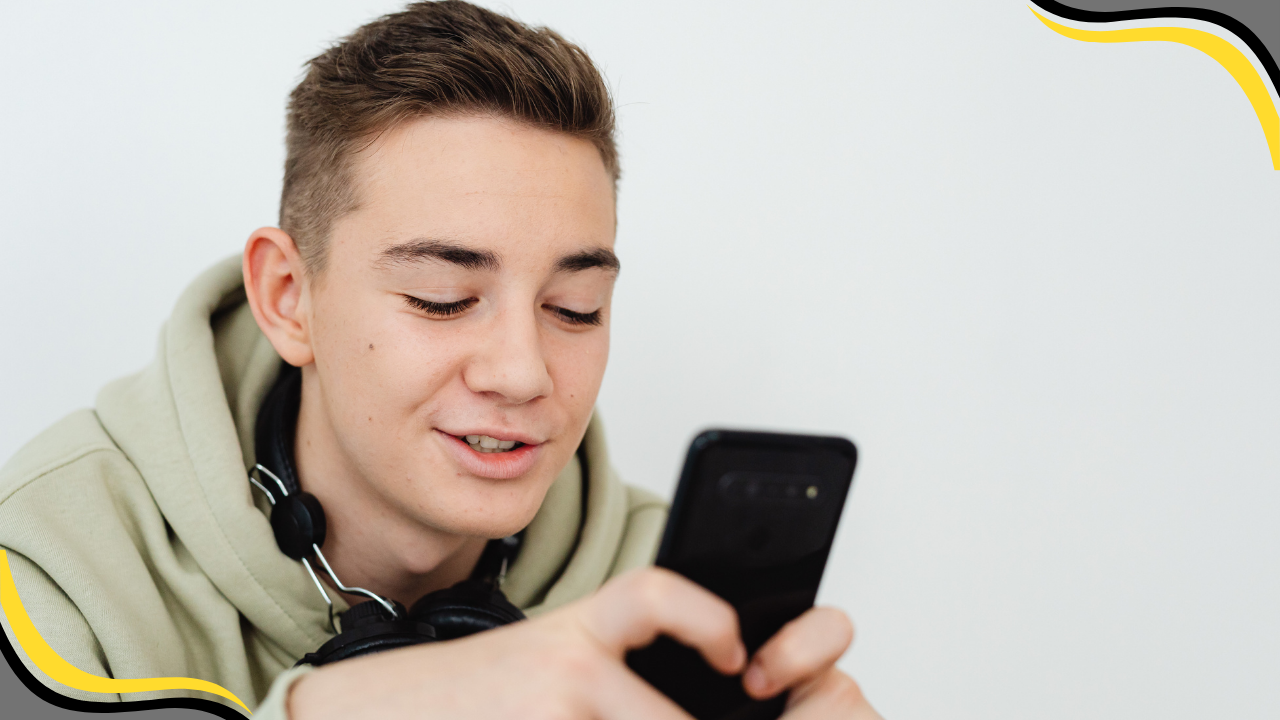 teen looking at their phone
