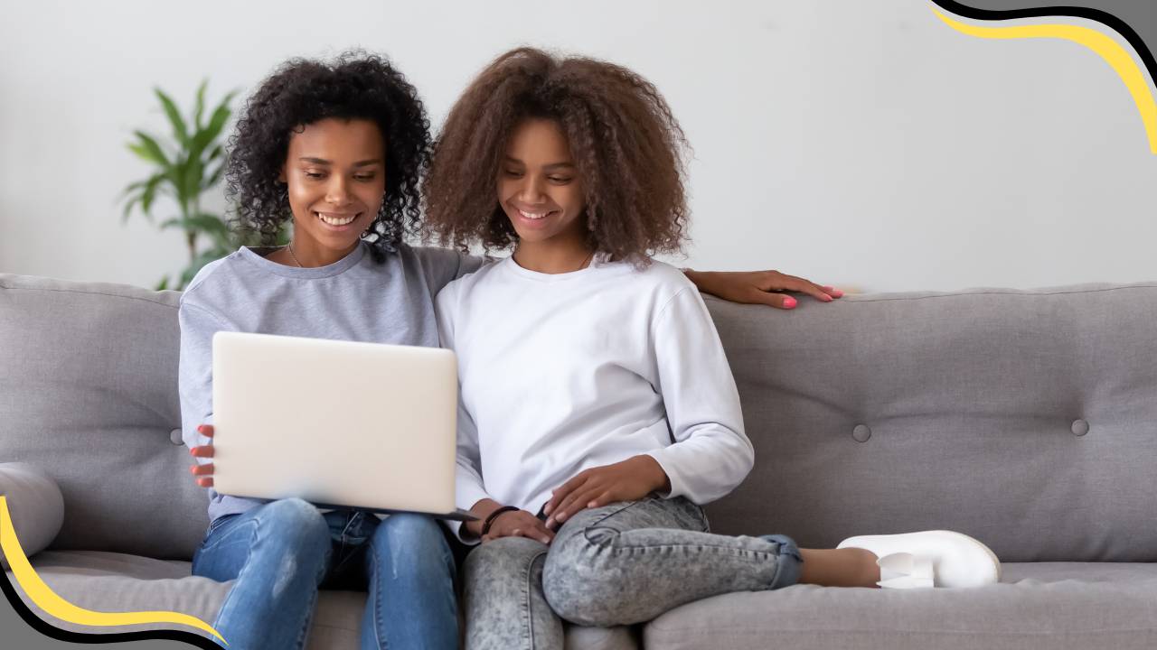 teen and parent looking at a laptop