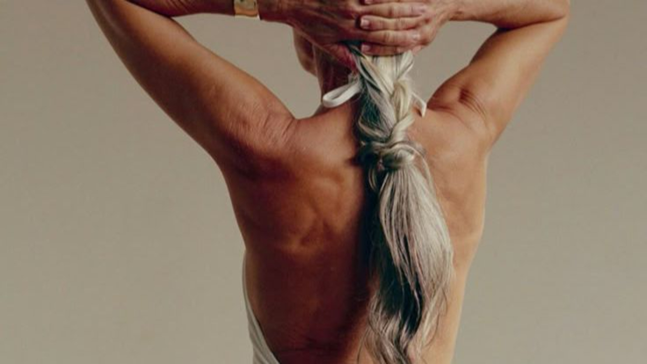 Woman strength training during menopause to fix common workout mistakes.