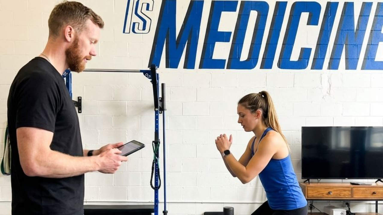 Patient working with a provider at a performance physical therapy clinic in Decatur, GA during an initial evaluation
