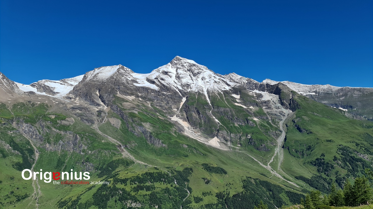 Mountain with ice and snow on top and a clear blue sky