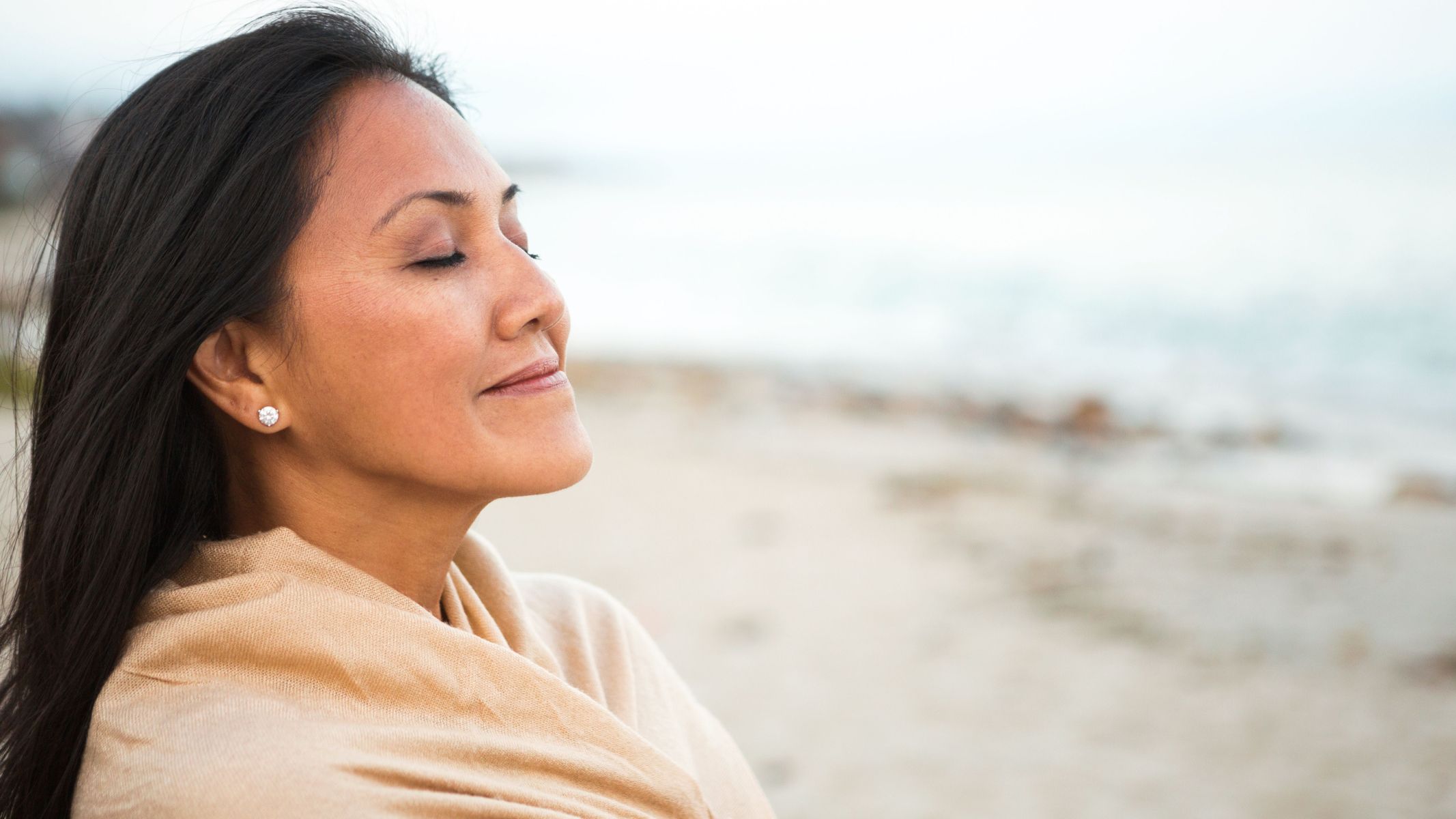 Beautiful woman at beach healthy aging mind body soul