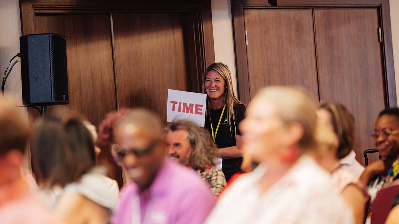 Girl holiding up Time notice