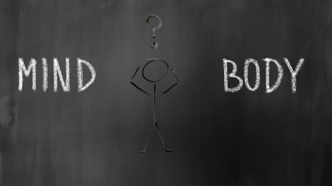illustration showing a stick figure between the words mind and body with a question mark above the head, representing the mind body disconnect and confusion that can occur when life is out of alignment with personal truth