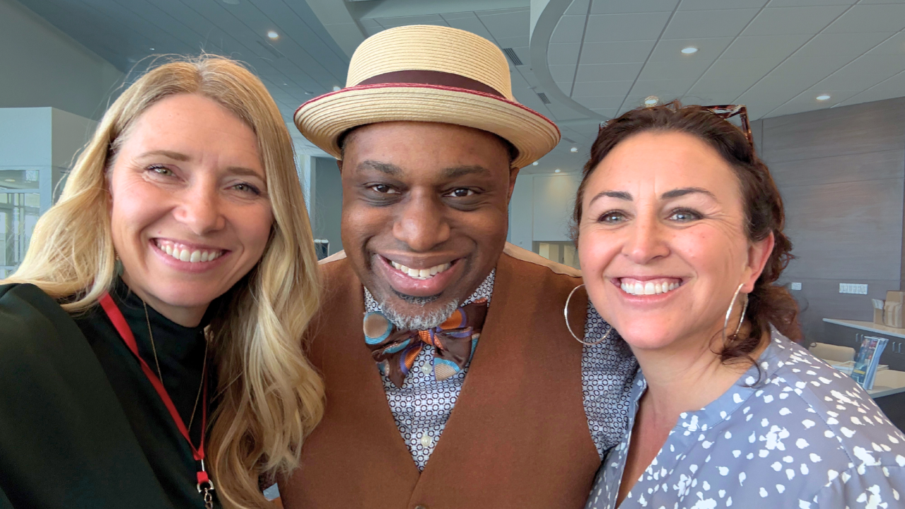 3 people looking into a camera and smiling