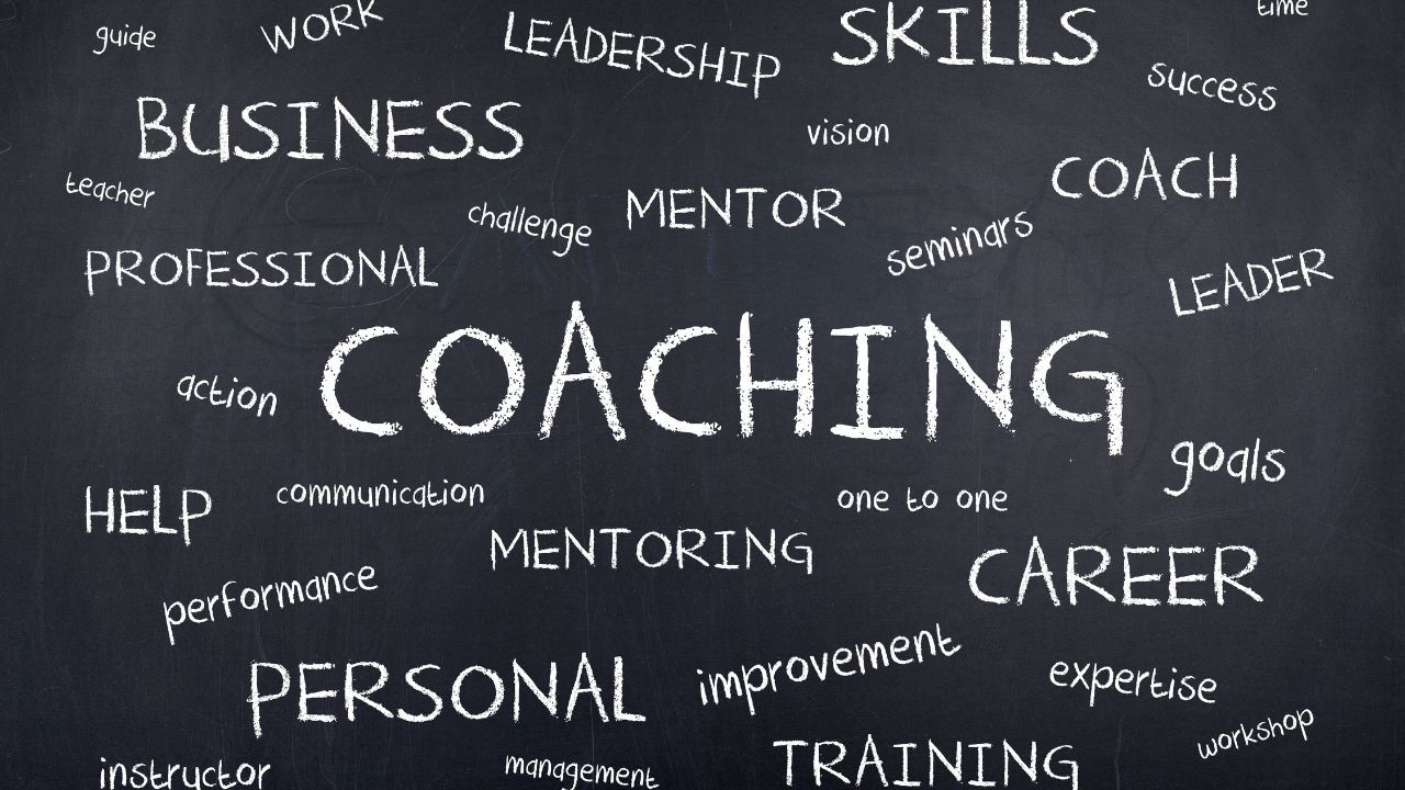 coaching word cloud written on chalkboard