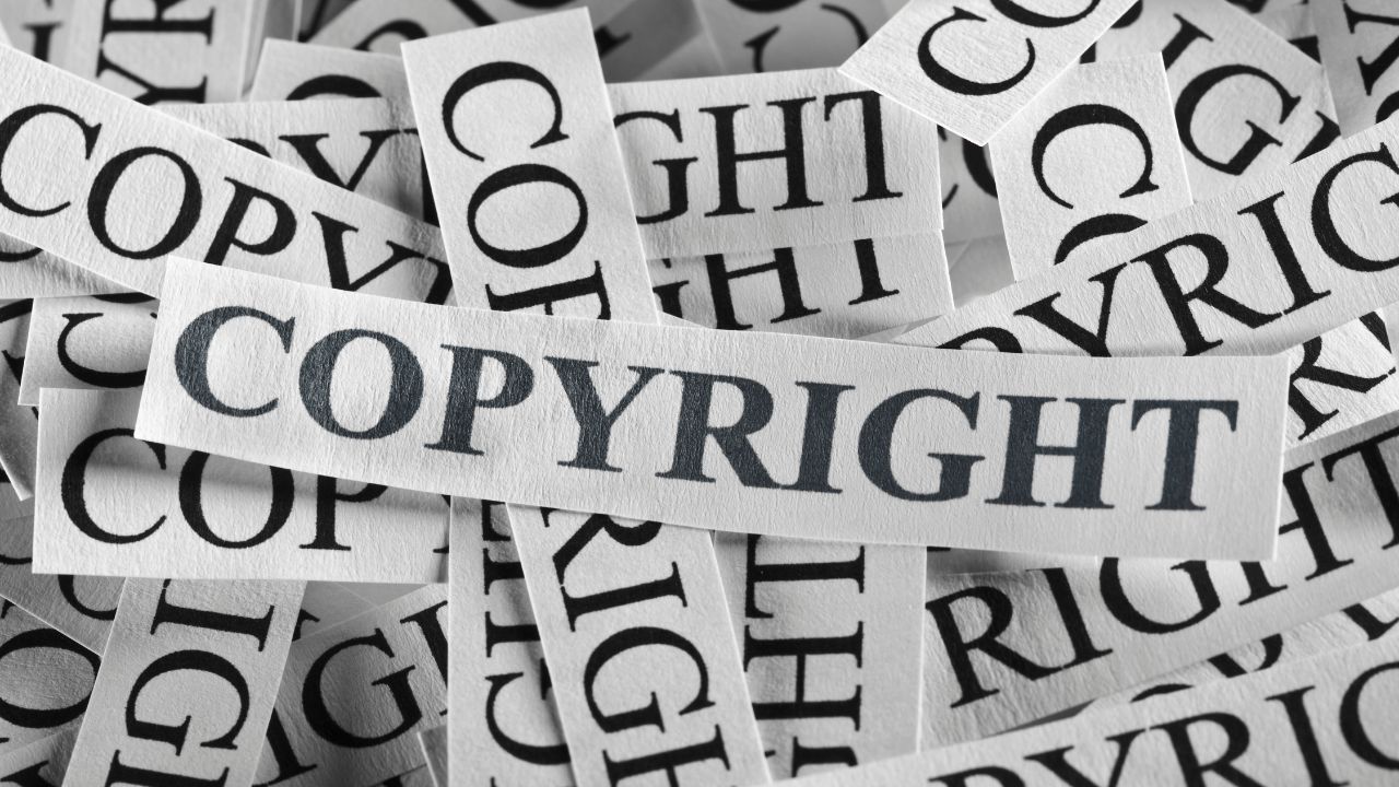 word copyright on white rectangular pieces of paper all in a pile