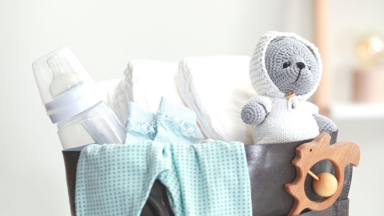 Bare minimum baby essentials image of basket full of new baby stuff