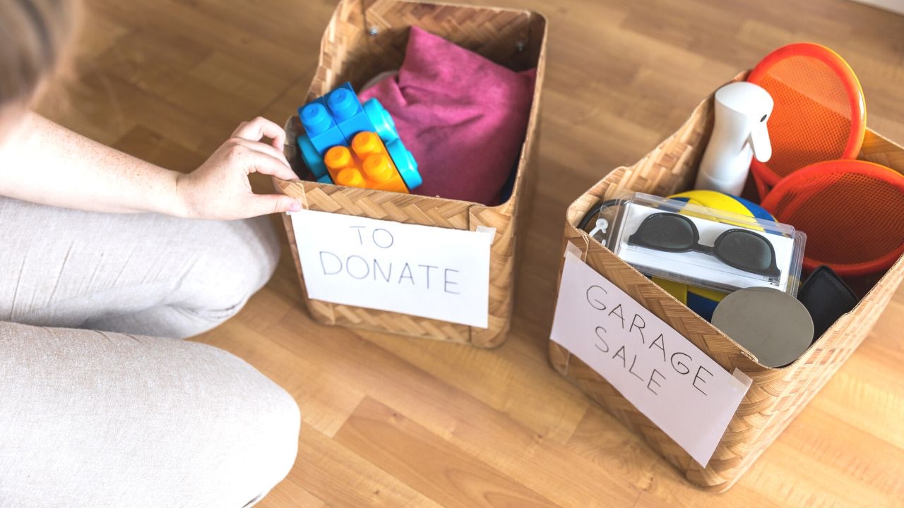 Decluttering when overwhelmed image of donate and garage sale boxes with stuff in them