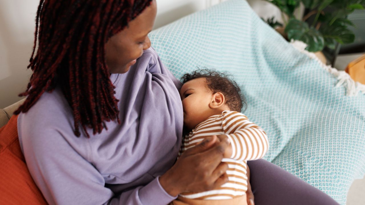Mother Using her infant's reflexes for latching