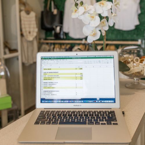 Laptop computer showing spreadsheet used to track numbers related to an inventory based business