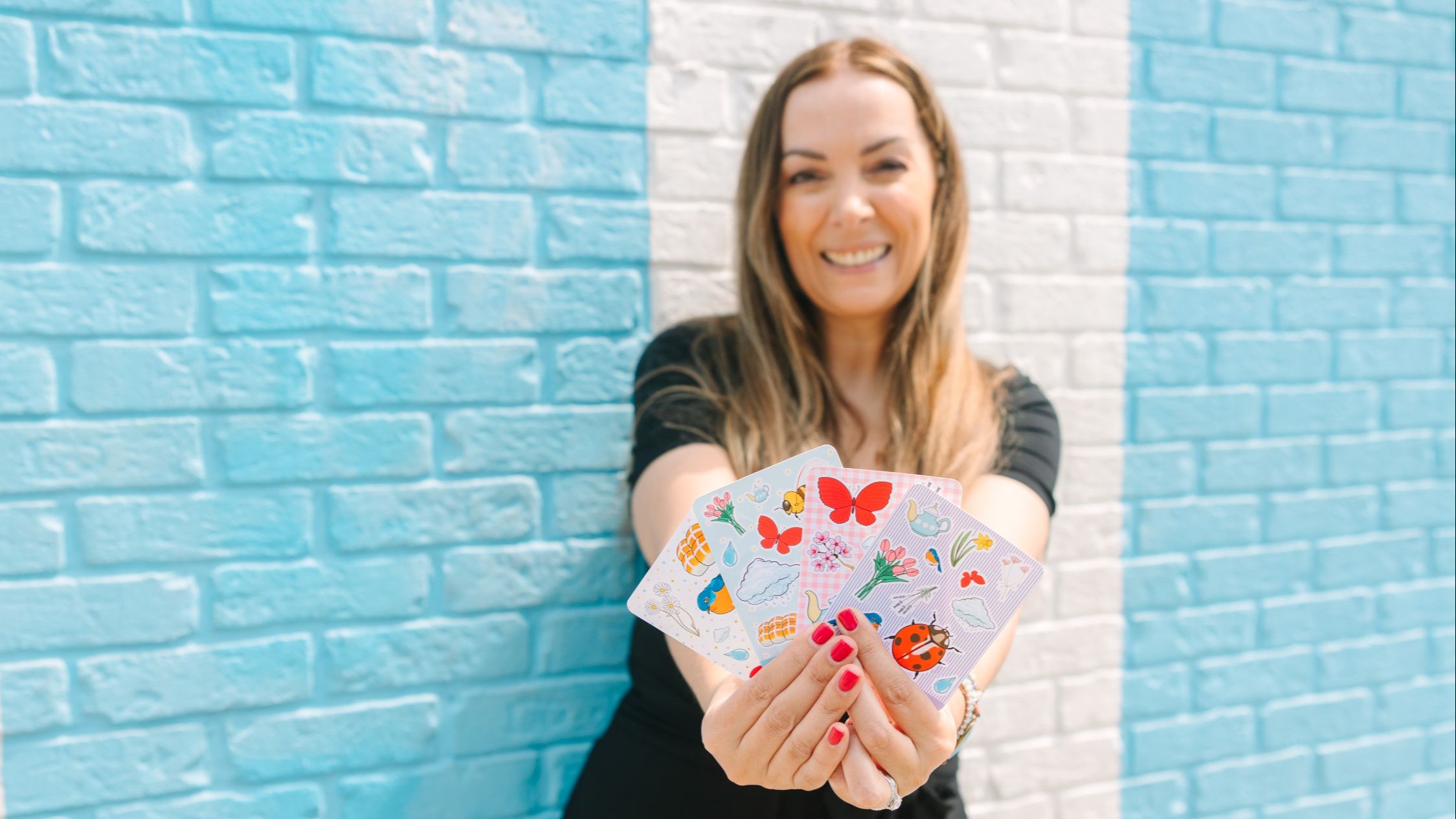 Mim holding sticker sheet inspiration for how to enjoy sticker making more