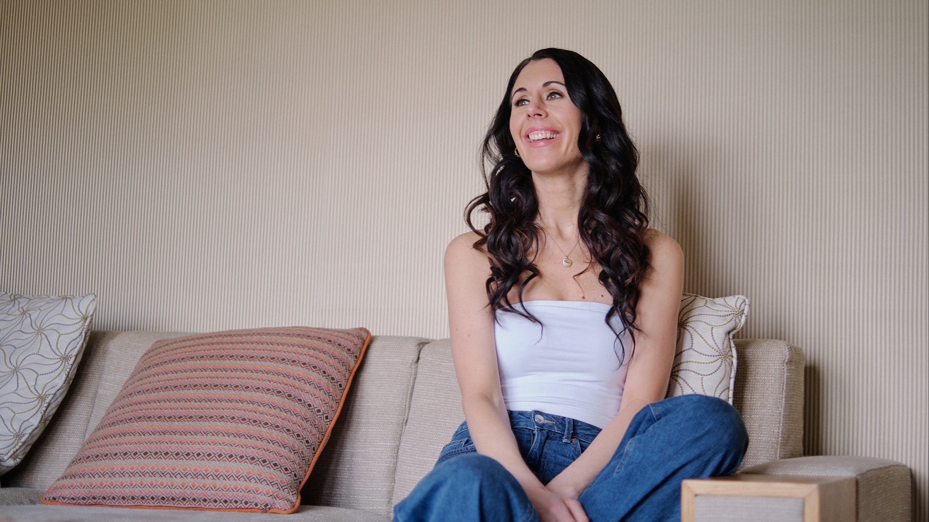 Danielle collins on beige sofa