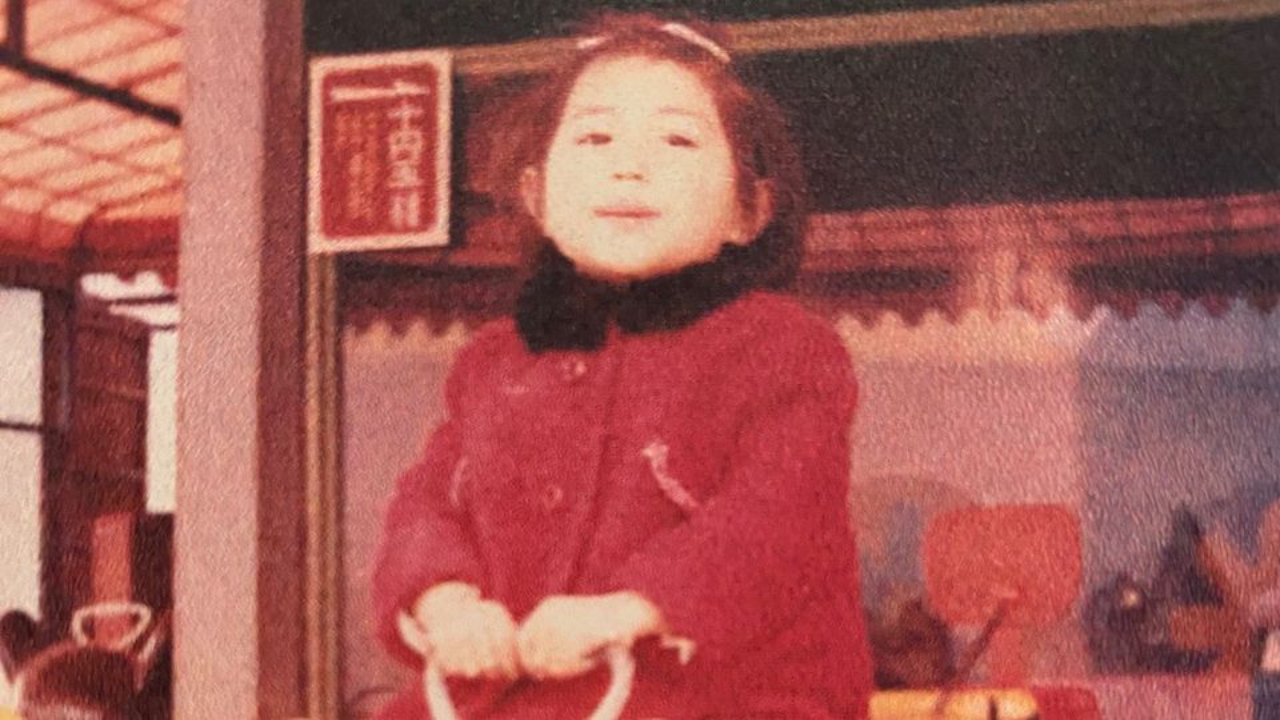 A three years old myself riding on a piggy shape amusement ride.