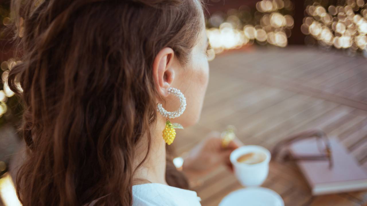 Woman sitting in focus with blurred background