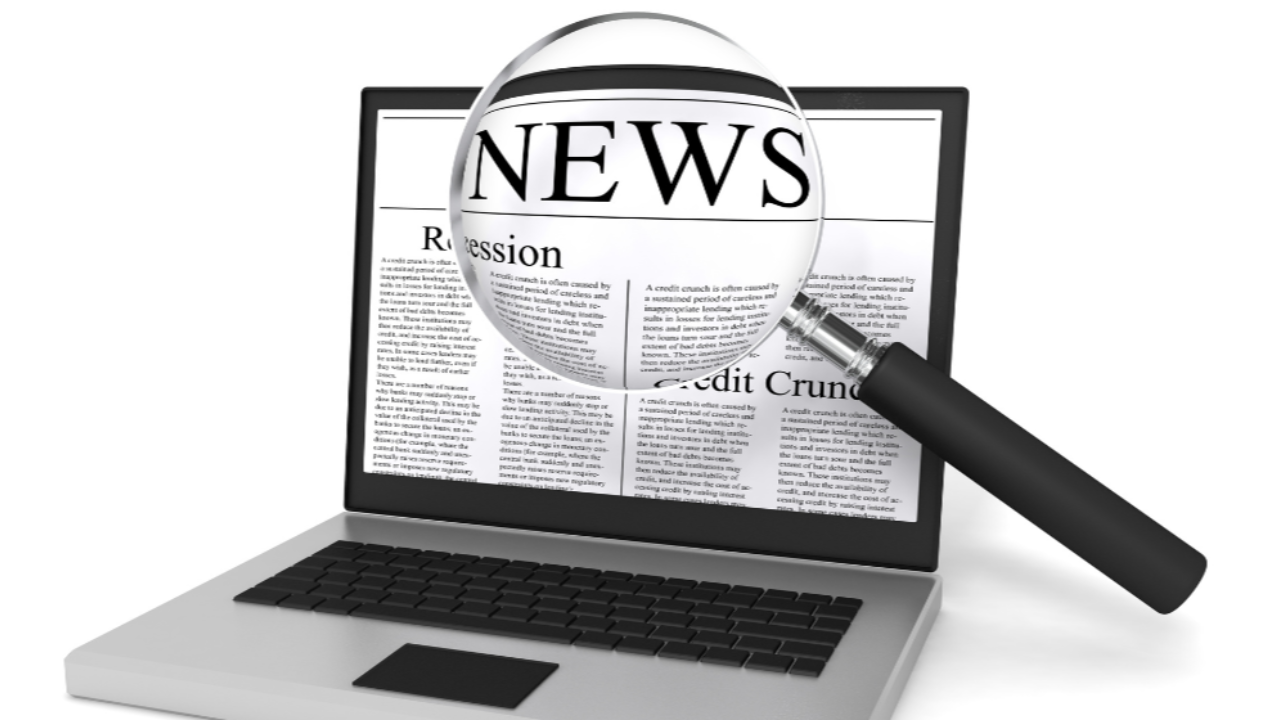 a magnifying glass over the word “News”