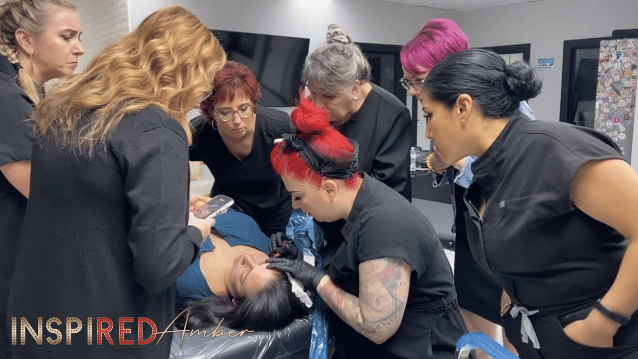 permanent makeup workshop training with artist practicing eyeliner technique on model with instructor guidance