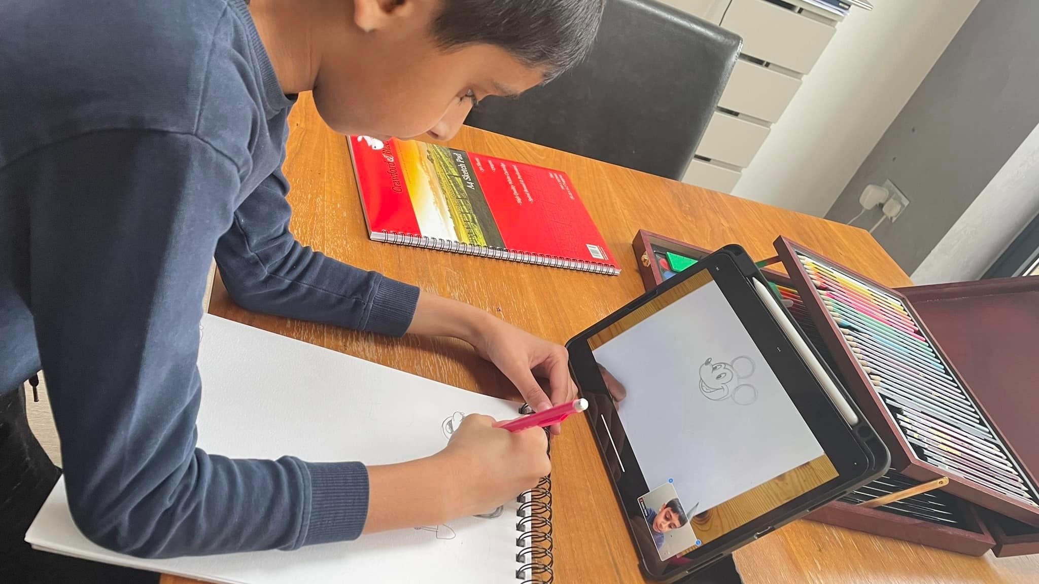 kid drawing a cartoon