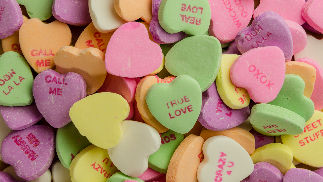 Conversation hearts in a pile