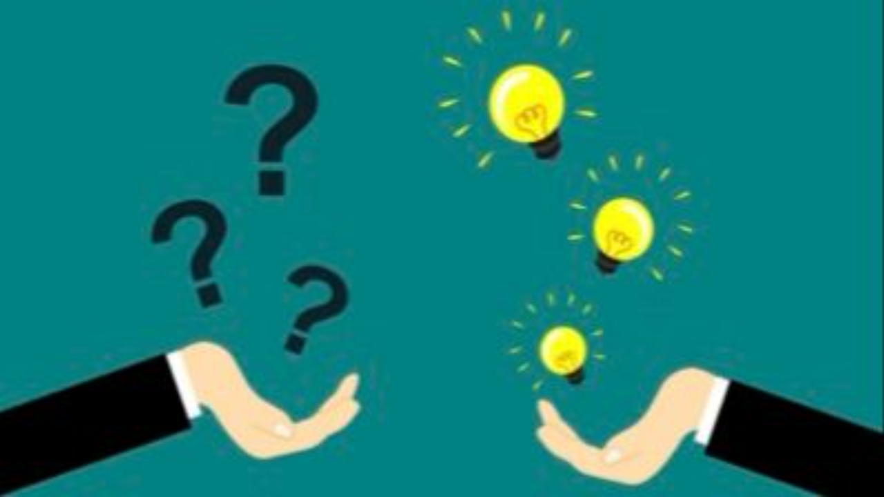 Hands with question marks and lights signifying the Michigan therapists uses solution-focused therapy uses goal setting to support clients.