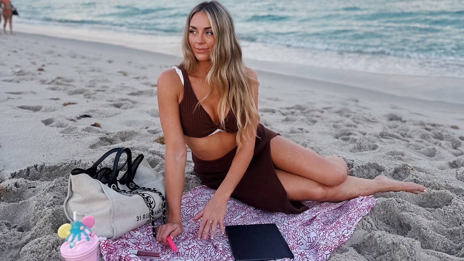 Brittany Arnason journaling on the beatch